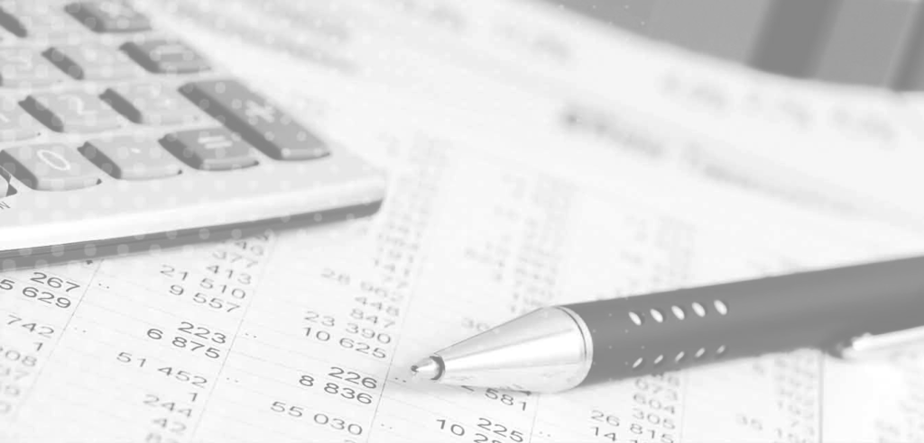 Up close accounting image of a pen and calculator