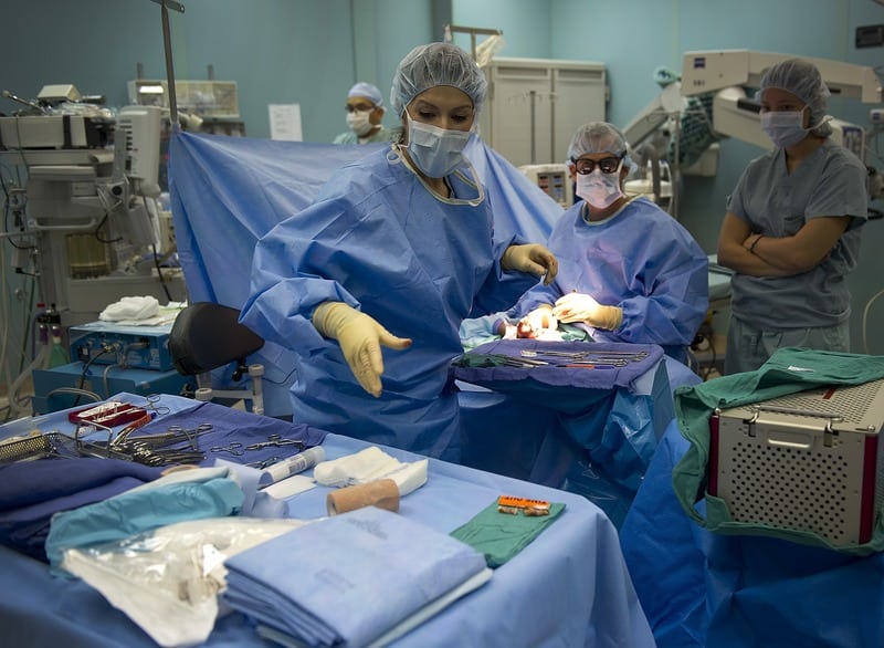 Surgical technicians are in the operating room