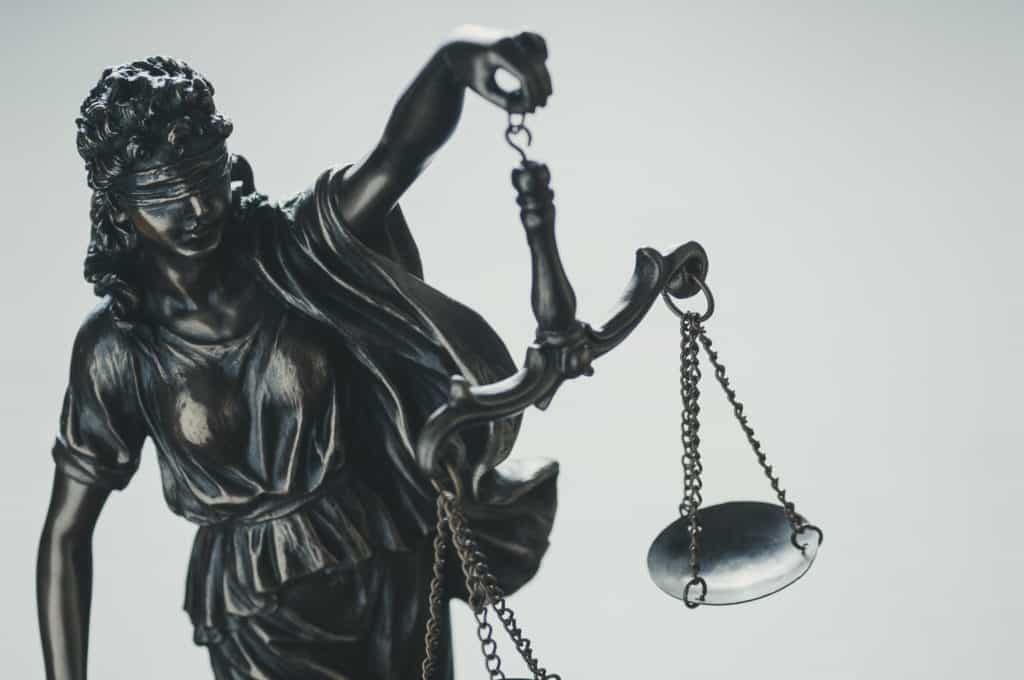 Statue of Justice Holding Aloft Scales