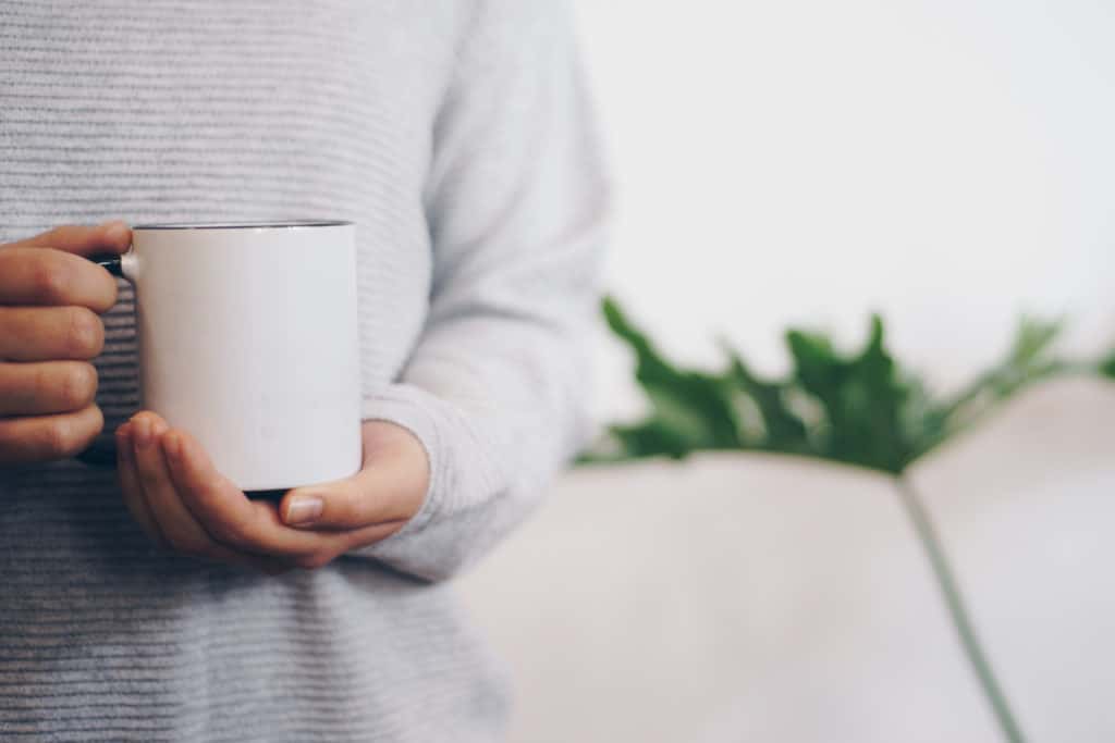 Hand Holding Coffee Cup