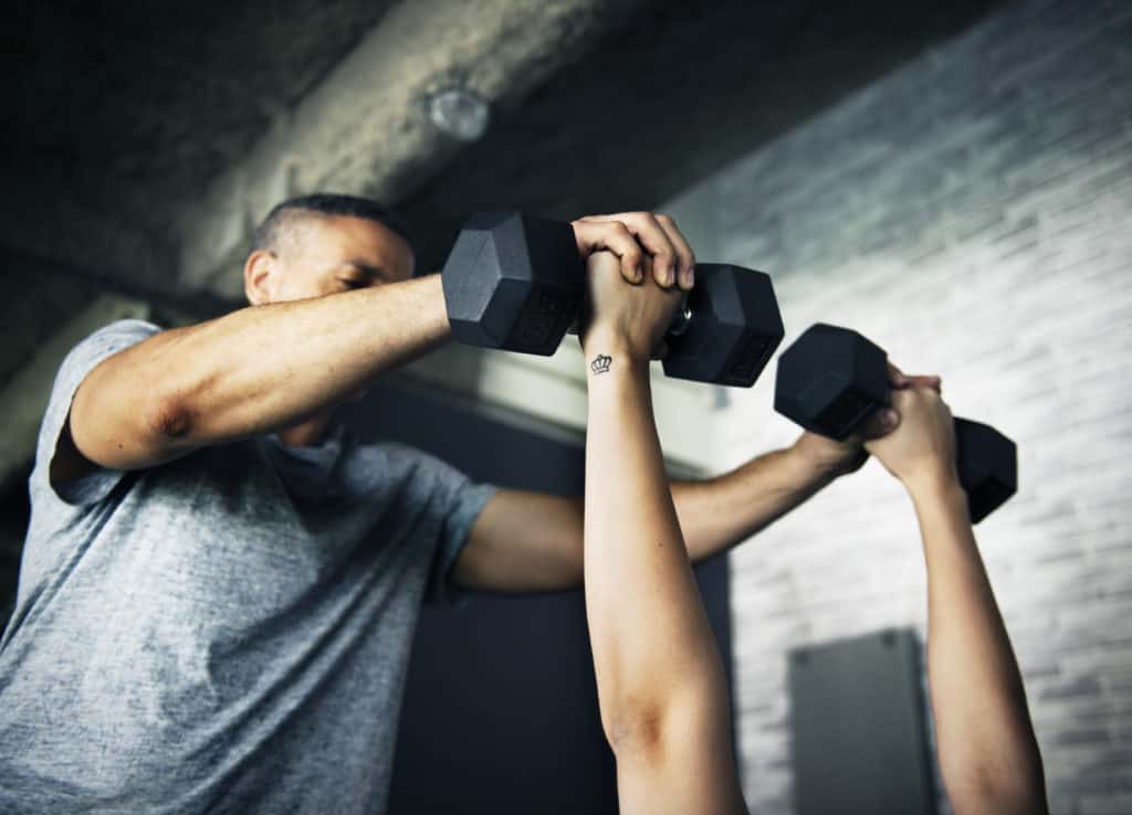 Fitness and Health Training people with dumbbells