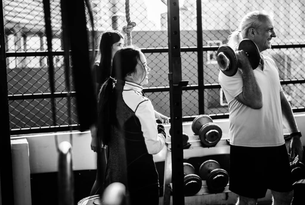 People exercising at fitness gym